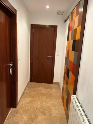 a hallway with a door and a tile floor at Casa Dani in Sueca