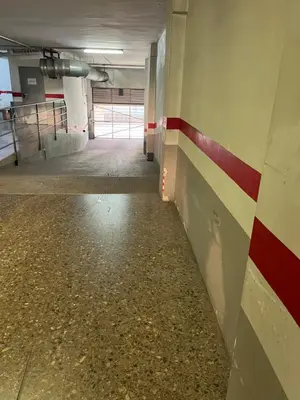an empty hallway in a building with a red stripe on the wall at Casa Dani in Sueca