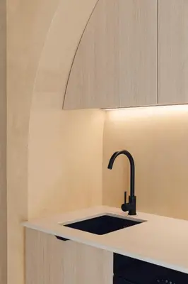 a kitchen with a sink with a faucet at Oasis suites ruzafa in Valencia