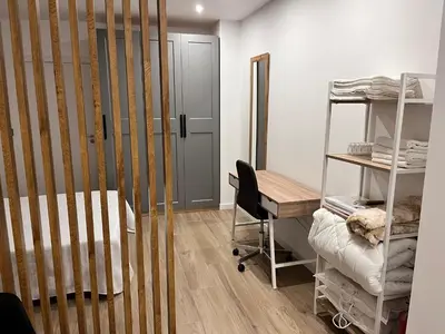 a room with a bed and a desk and a room with a bunk bed at Loft en puerto de Valencia in Valencia