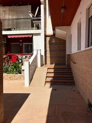 a building with stairs and a brick wall at Apartment near the beach in Valencia
