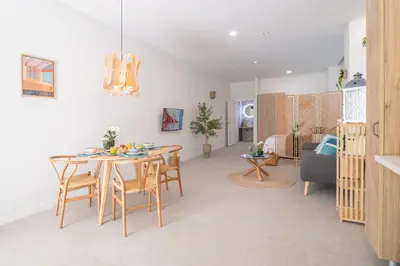 a dining room and living room with a table and chairs at RM29 Loft Valencia - Espacioso estudio con terraza en zona Ayora in Valencia