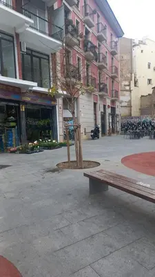 a building with a sign on the side of a street at Valencia Aparthotel HBB in Valencia