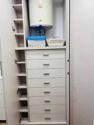 a white cabinet in a room with a bedroom at Lugar junto al mar in Casas Las Basas