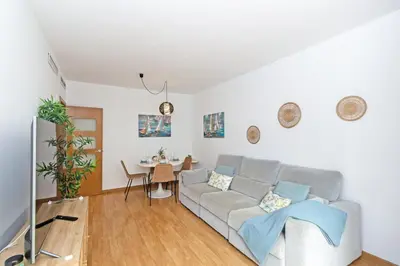 a living room with a couch and a table at GuestReady - Lovely home near the beach in Valencia