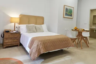 a bedroom with a large bed and a table at Loft 9B JAIME II in Valencia