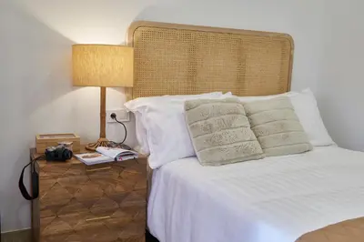 a bedroom with a bed with white sheets and pillows at Loft 9B JAIME II in Valencia