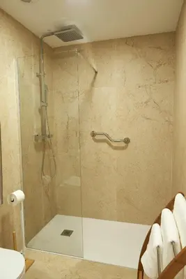 a shower with a glass door in a bathroom at Loft 9B JAIME II in Valencia