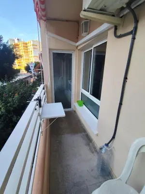a balcony with a bench and a window at Precioso estudio en la playa norte de Valencia in Puebla de Farnals