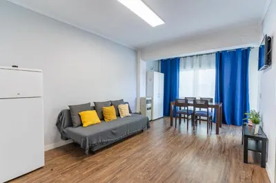 a living room with a couch and a table at Precioso estudio en la playa norte de Valencia in Puebla de Farnals