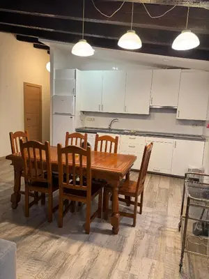 a kitchen with a wooden table and wooden chairs at Miguelete tower & 4th FLOOR & City center and no elevator in Valencia