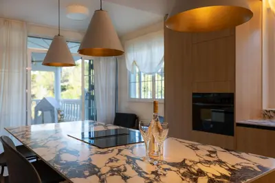 a dining room with a table with a wine glass on it at Casa Roka in Alberique