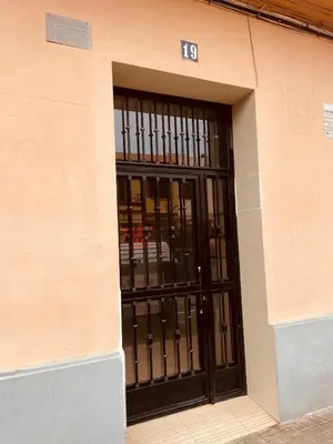 a building with a door with the number at Casa Calma - Modern Apartment, Perfect Location - All you need for a great time in Valencia in Valencia