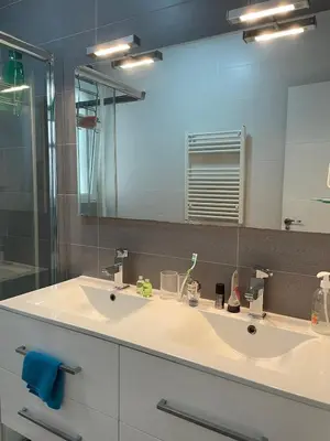 a bathroom with a white sink and a mirror at Casa Calma - Modern Apartment, Perfect Location - All you need for a great time in Valencia in Valencia