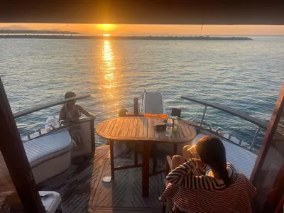 a woman sitting at a table on a boat at Xanquete in Valencia