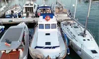 a group of boats docked in a harbor at Xanquete in Valencia