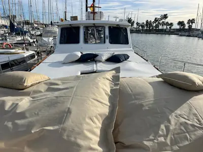 a boat in the water with pillows on it at Xanquete in Valencia