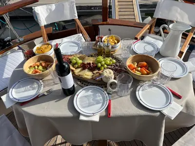 a table with a plate of food and a bottle of wine at Xanquete in Valencia