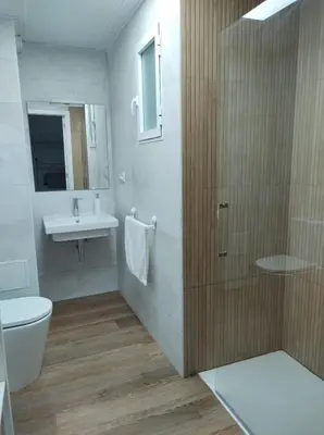 a bathroom with a toilet and a sink and a shower at District Key - Valencia, Plaza del Cedro in Valencia