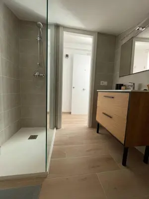 a bathroom with a shower and a vanity and a sink at More then a loft in Godella