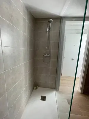 a shower with a glass door in a bathroom at More then a loft in Godella