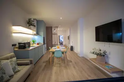 a living room with a couch and a table at Nomad Haux Mestalla Apartments in Valencia