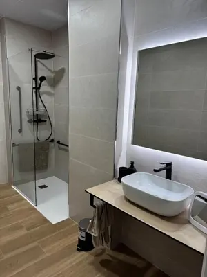 a bathroom with a sink and a shower at Apartamento playa malvarrosa in Valencia