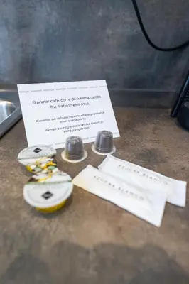 a piece of paper sitting on top of a counter with three batteries at Les Arts Plaza by Concept Flats in Valencia