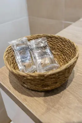 a basket of water bottles sitting on a counter at Les Arts Plaza by Concept Flats in Valencia