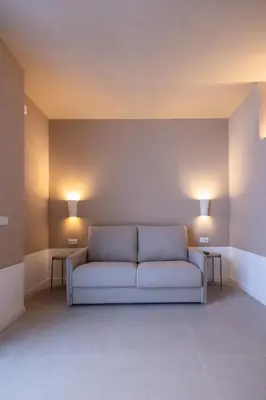 a living room with a couch and two tables at Abastos by Concept Flats in Valencia