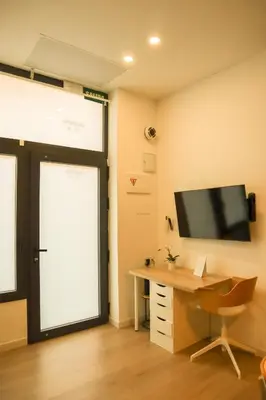 a hallway with white walls and a wooden floor at Valentia Modern and Comfortable Beachside Style in Valencia