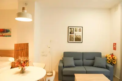 a bathroom with a shower and a sink and a toilet at Valentia Modern and Comfortable Beachside Style in Valencia
