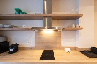 a kitchen with a yoga mat on the floor at Porto by Concept Flats in Valencia