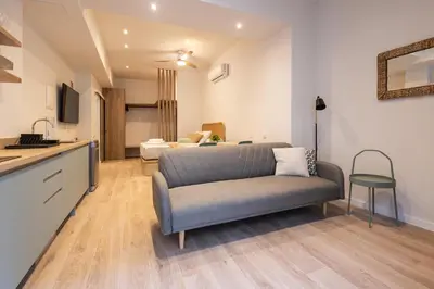 a living room with a couch and a bedroom at Porto by Concept Flats in Valencia
