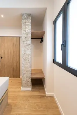 a room with a stone pillar and a window at Lisboa by Concept Flats in Valencia
