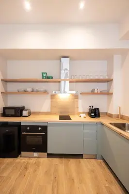 a kitchen with a counter top and a sink at Lisboa by Concept Flats in Valencia