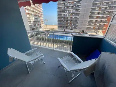 two chairs on a balcony with a view of the ocean at Paradise Cullera in Cullera