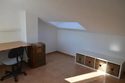 an office with a desk and a table and a chair at Arbocer playa Puçol in Puzol