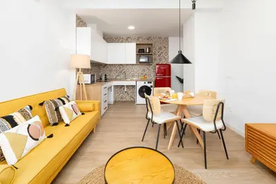 a living room with a couch and a table at Travel Habitat Peset Aleixandre Apartments in Valencia