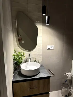 a bathroom with a sink and a mirror at Cozy apartment Valencia in Valencia