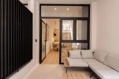 a living room with a couch and a table at Luxury Apartments Oceanografic in Valencia