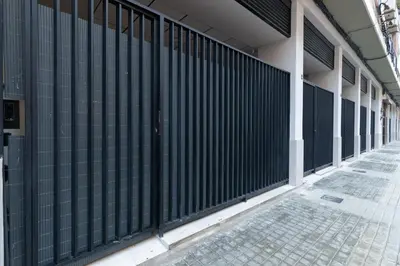 a black fence on the side of a building at Luxury Apartments Oceanografic in Valencia