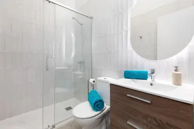 a bathroom with a toilet and a sink and a mirror at Apartamento 2º nuevo 400 mt al mar in Valencia