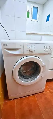 a white washing machine sitting in a room at Vacansis Loft Plaza del Pilar in Valencia