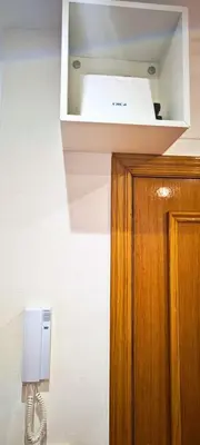 a kitchen with a white appliance in a wall at Vacansis Loft Plaza del Pilar in Valencia