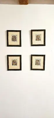 three framed pictures on a white wall at Vacansis Plaza de la Reina in Valencia