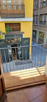 a view of a building from a balcony at Vacansis Plaza de la Reina in Valencia