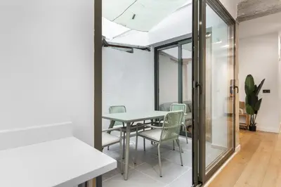 a dining room with a table and chairs at Turía Flats by Nomad Host in Valencia