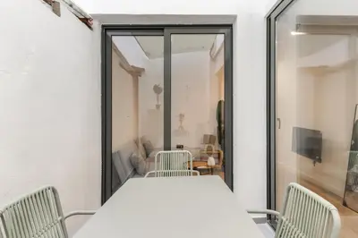 a dining room with a table and chairs at Turía Flats by Nomad Host in Valencia
