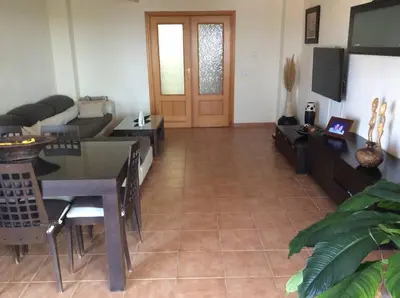 a living room with a couch and a table at Valencia, villa, piscina privada, junto A-7 cerca de playas, aeropuerto, Cheste in Torrent